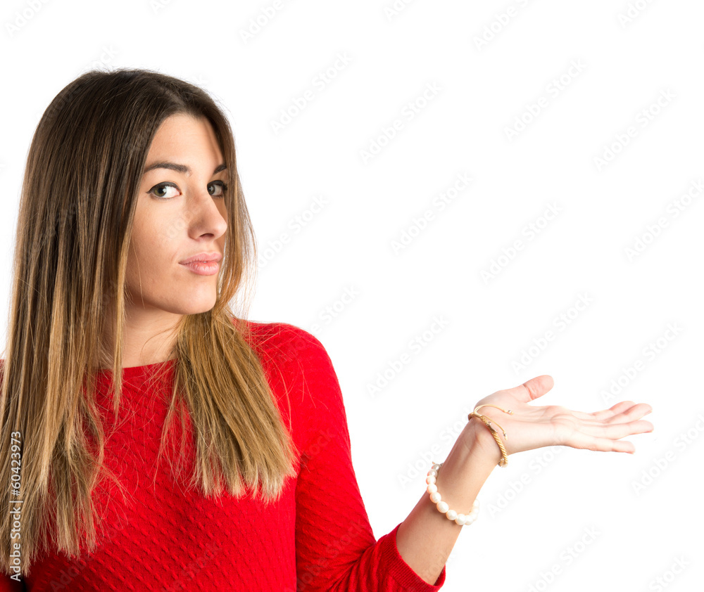 Cute young girl having doubts over isolated white background Cute young girl having doubts over isolated white background