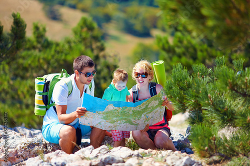 family in mountains discussing the route photo