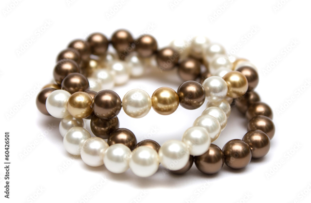 Bracelet of brown, yellow and white pearls. Bracelet of brown, yellow and white pearls.