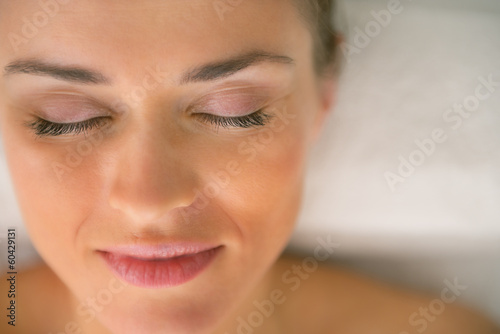 Closeup on young woman laying on massage table
