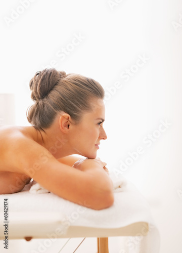 Young woman laying on massage table