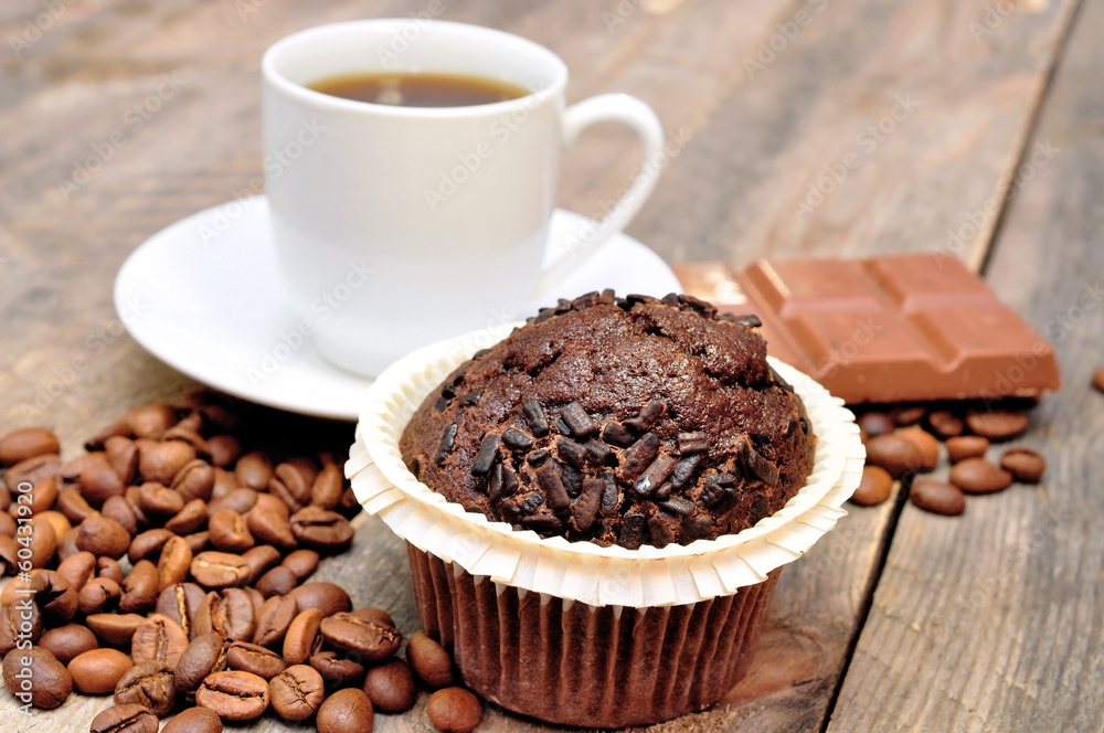 cup of coffee with muffin and chocolate cup of coffee with muffin and chocolate