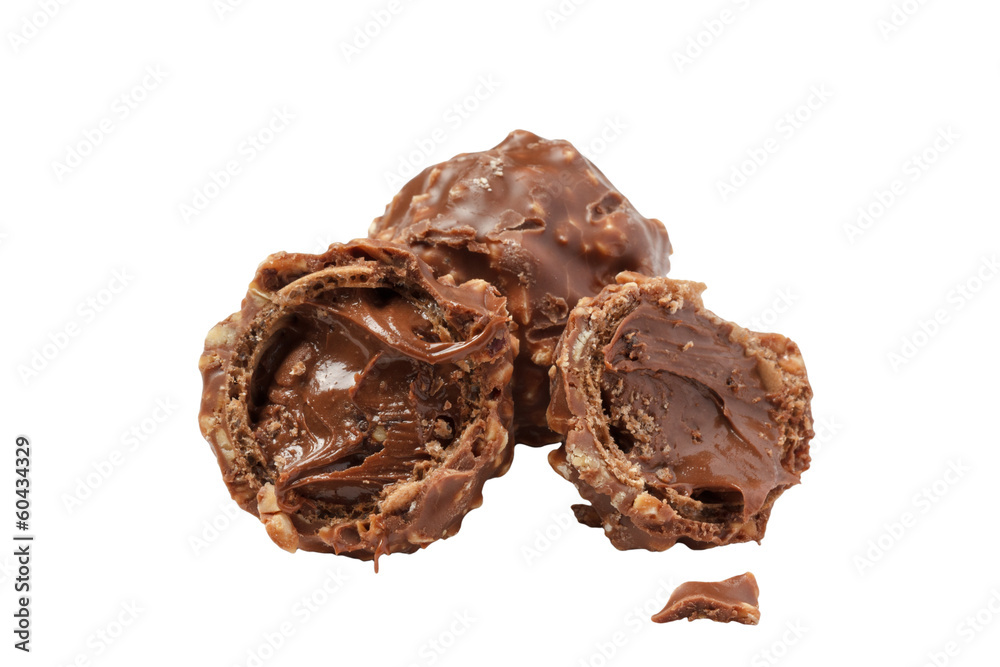 Chocolate candies with nuts and praline isolated on white Chocolate candies with nuts and praline isolated on white