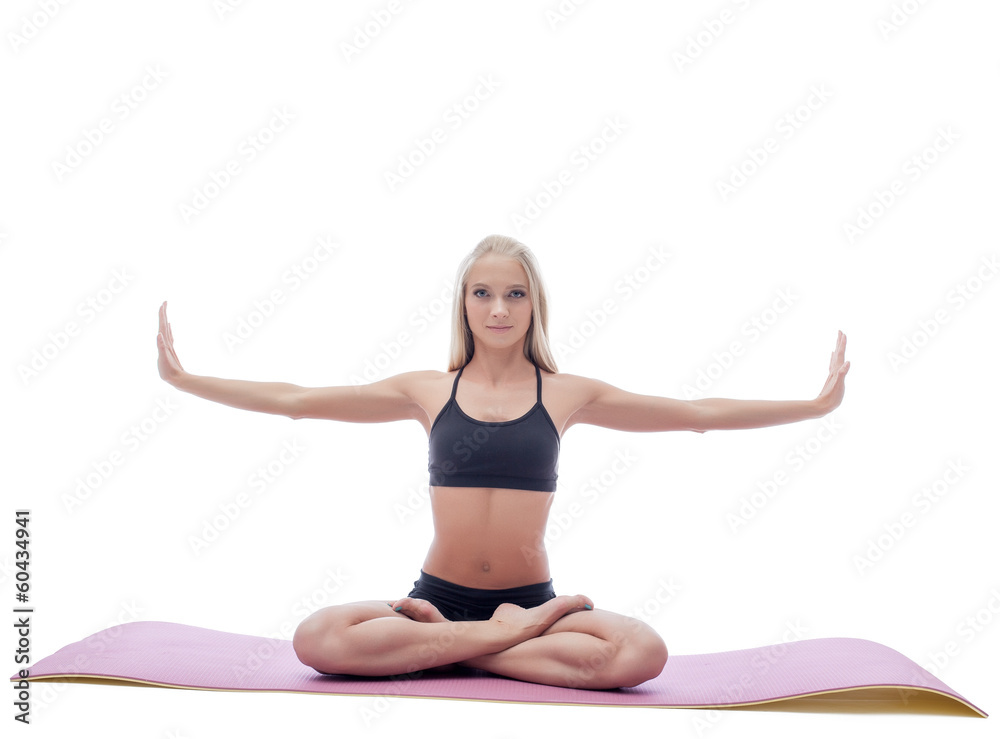Image of attractive slim woman doing yoga on mat Image of attractive slim woman doing yoga on mat