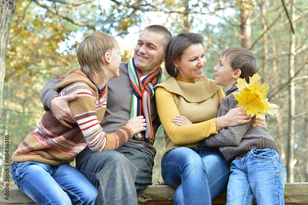 Happy family in the autumn park Happy family in the autumn park