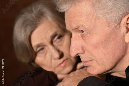 Sad elder couple