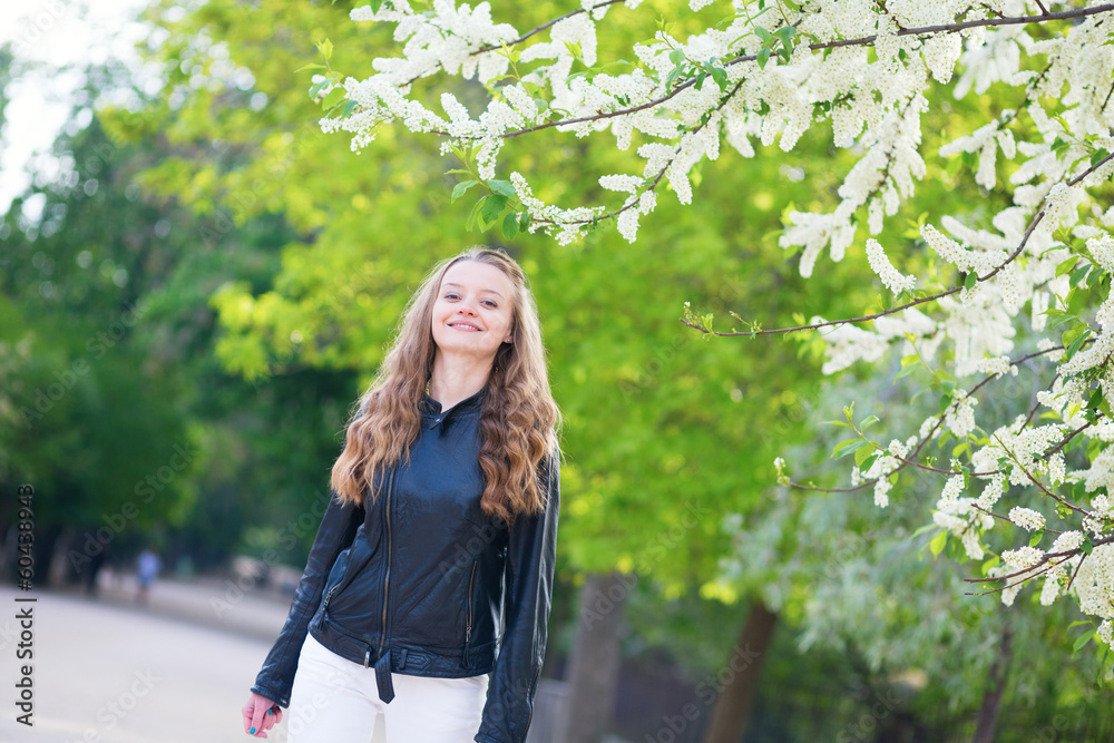 Beautiful young girl in a park on a spring day