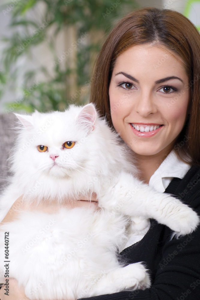 young girl hugging a white Persian cat young girl hugging a white Persian cat