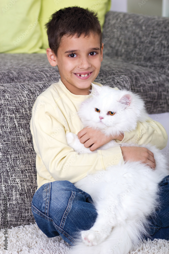 boy hugging a white Persian cat boy hugging a white Persian cat