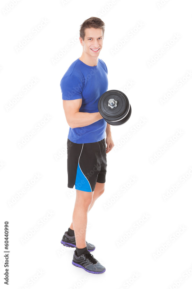Young Man Exercising With Dumbbells Young Man Exercising With Dumbbells