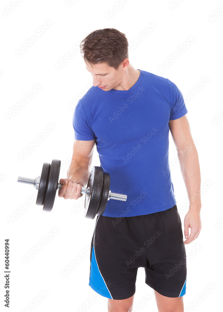Young Man Exercising With Dumbbells Young Man Exercising With Dumbbells
