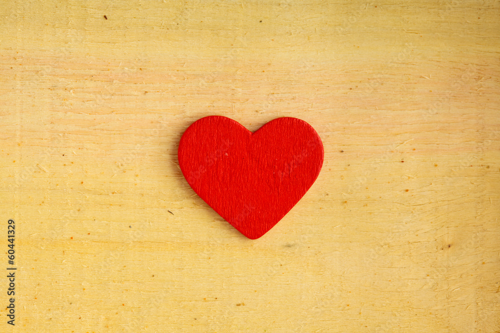 Red decorative heart on wooden background texture Red decorative heart on wooden background texture