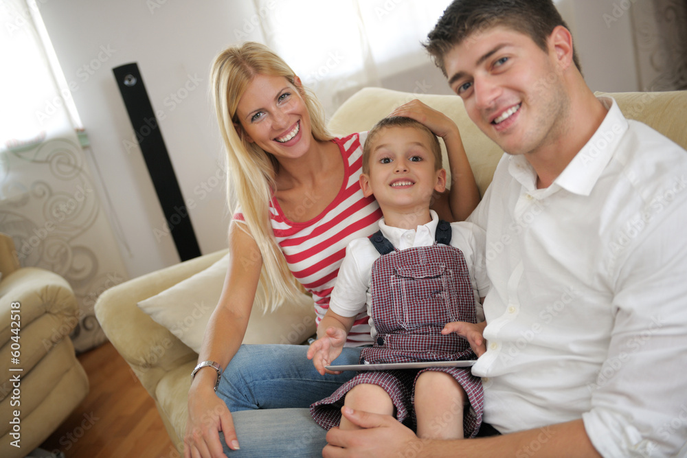 family at home using tablet computer family at home using tablet computer