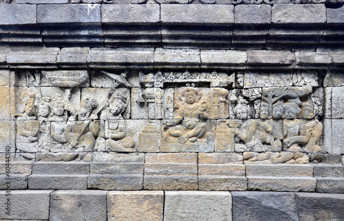 Buddhist bas-relief detail in borobudur temple sit
