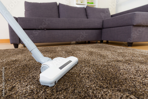 Vacuum cleaner on carpet photo