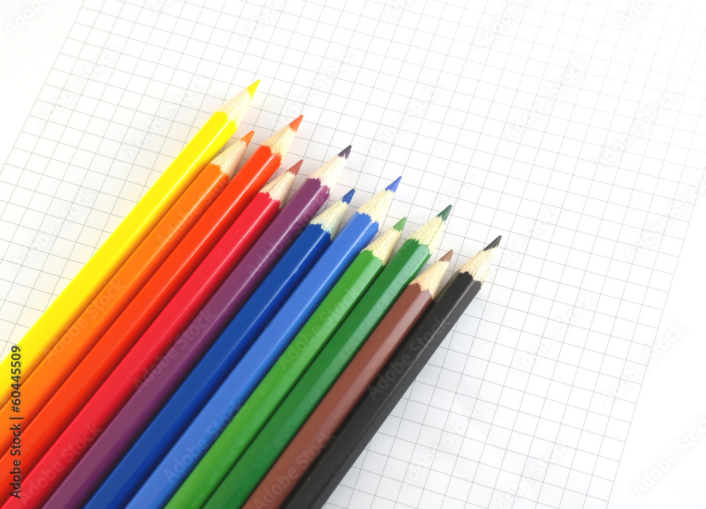 Color pencils on the checked paper Color pencils on the checked paper