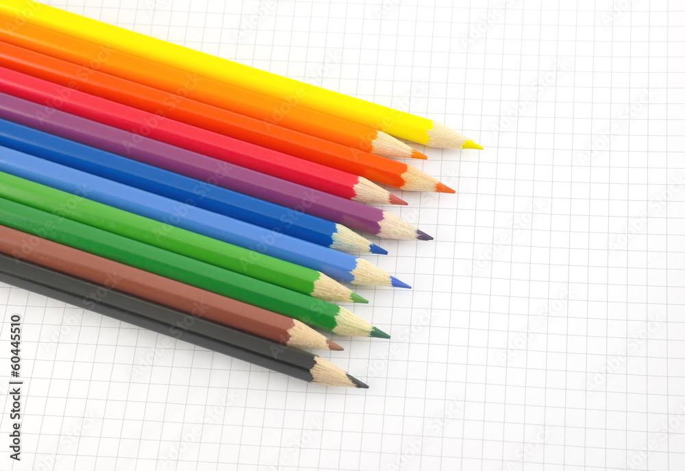 Color pencils on the checked paper Color pencils on the checked paper