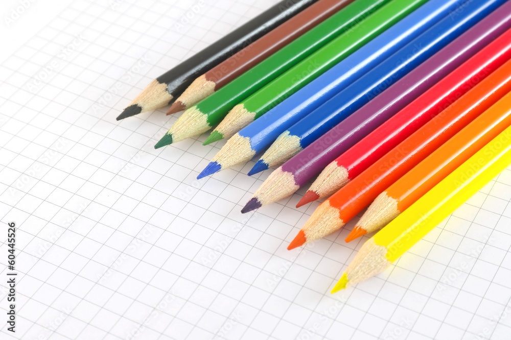 Color pencils on the checked paper Color pencils on the checked paper
