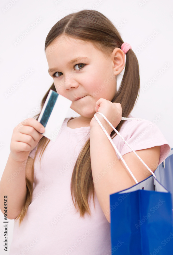 Cute girl with shopping bags