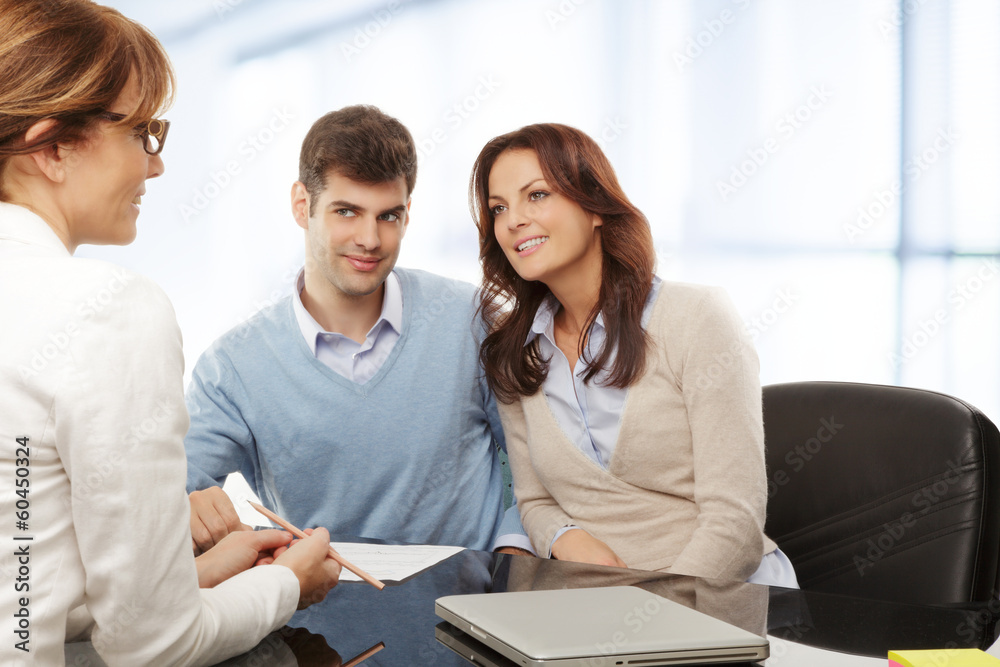 Young couple discussing financial plan with consultat