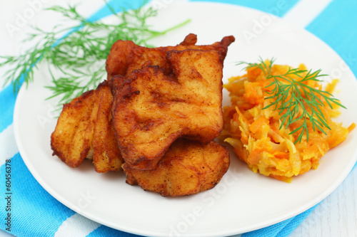Fried cod pieces with vegetables