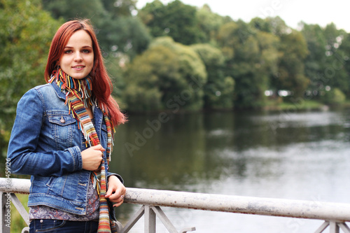 fashion woman on bridge in autumn park