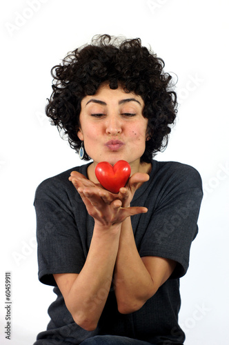 Woman kissing the heart