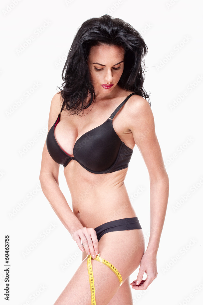 Naklejka premium Woman in Black Underwear Measuring Results of Diet