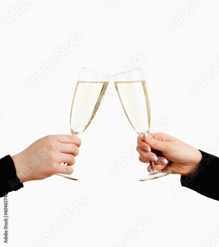 Two Hands Holding Glasses of Champagne Toasting