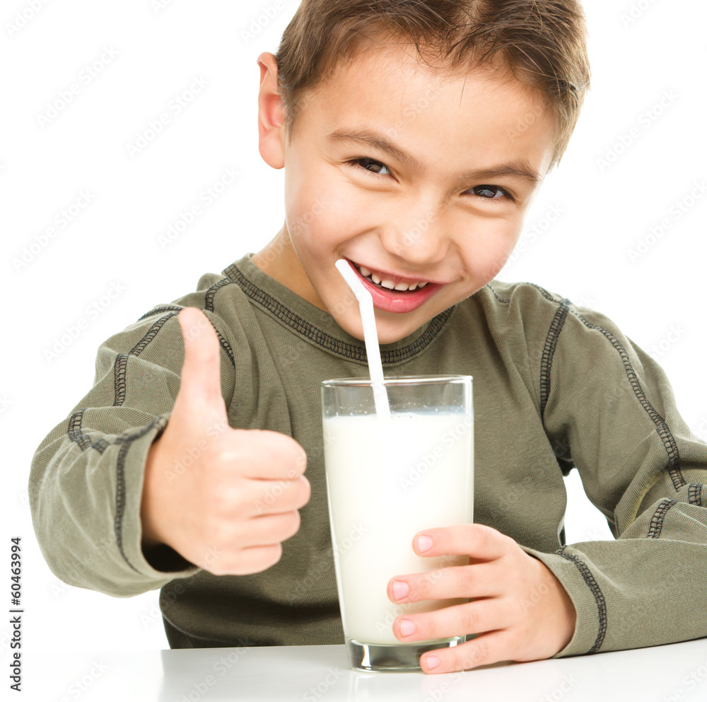 Cute boy with a glass of milk