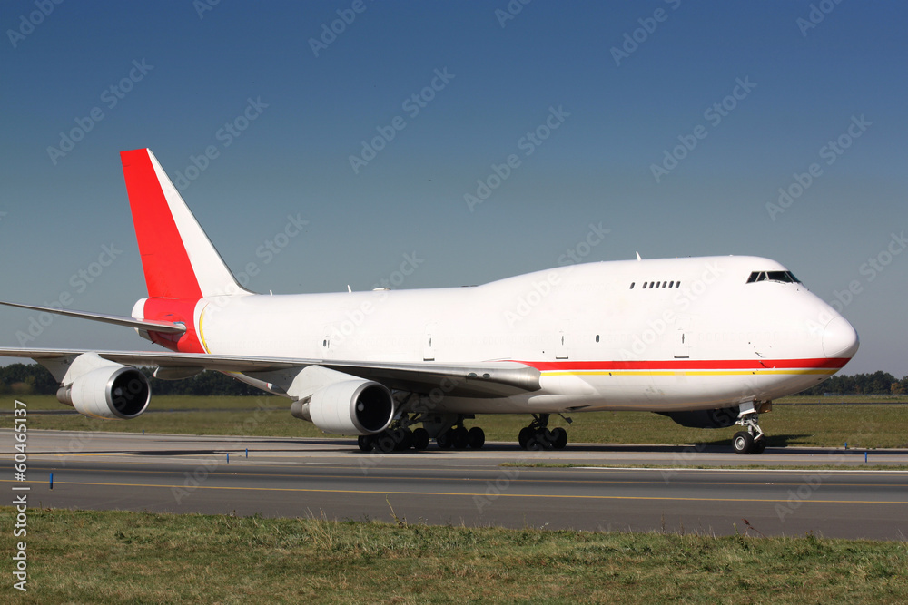 White cargo plane with red tail White cargo plane with red tail