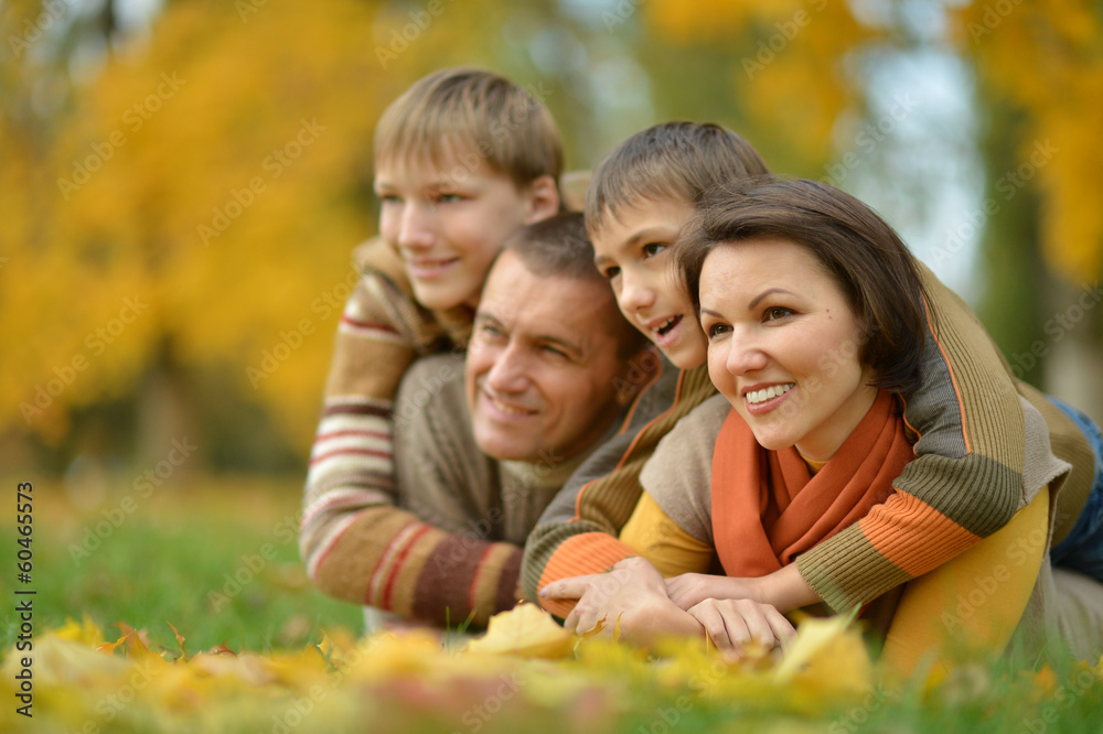 Happy family in the autumn park Happy family in the autumn park