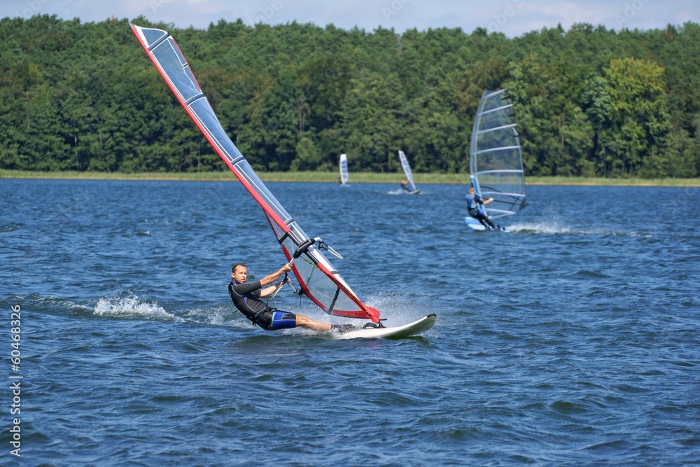 Naklejka premium Windsurfing on the lake Niesłysz, Poland