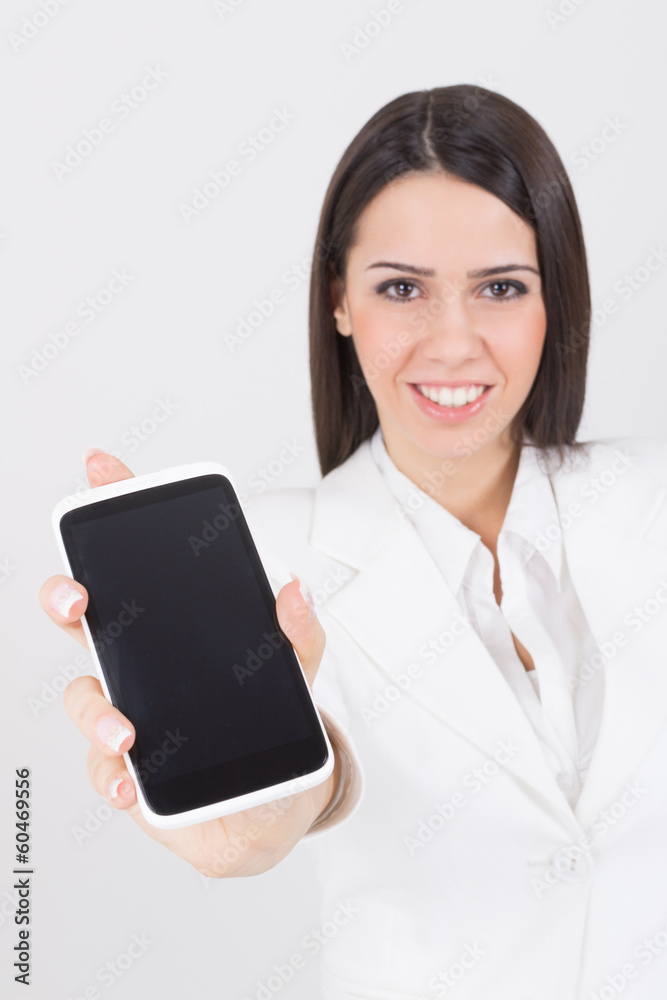 Businesswoman wearing white showing smart phone screen Businesswoman wearing white showing smart phone screen