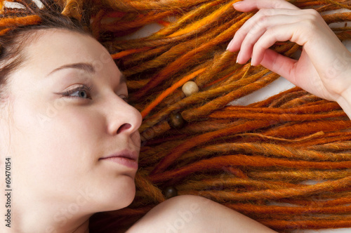 Beautiful girl with red dreadlocks