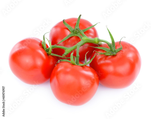 fresh tomatoes with green leaves isolated on white background