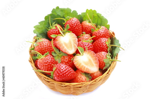 Strawberry in wicker basket on white background.