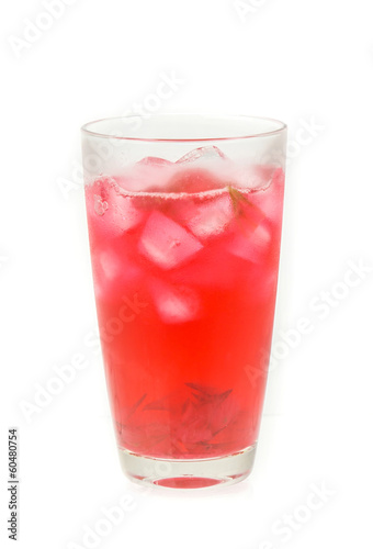 Glass of cold roselle juice with ice isolate on white