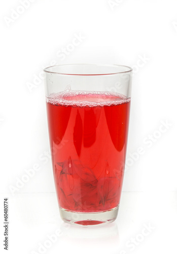Glass of roselle juice isolate on white