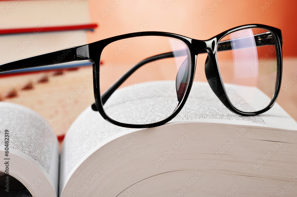 Composition with glasses and books on the table Composition with glasses and books on the table