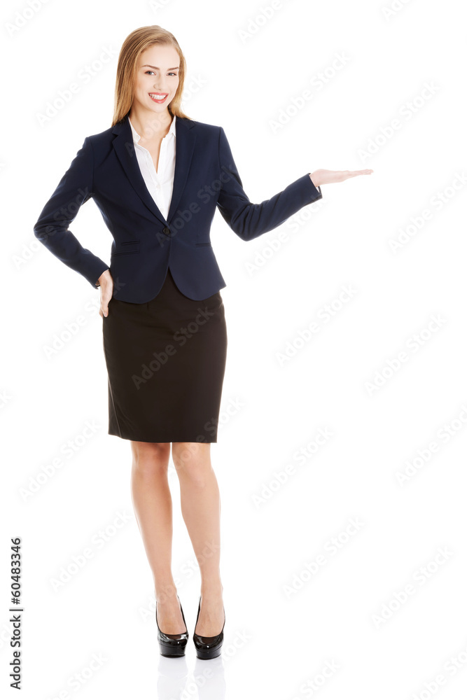 Beautiful business woman showing copy space on palms. Beautiful business woman showing copy space on palms.