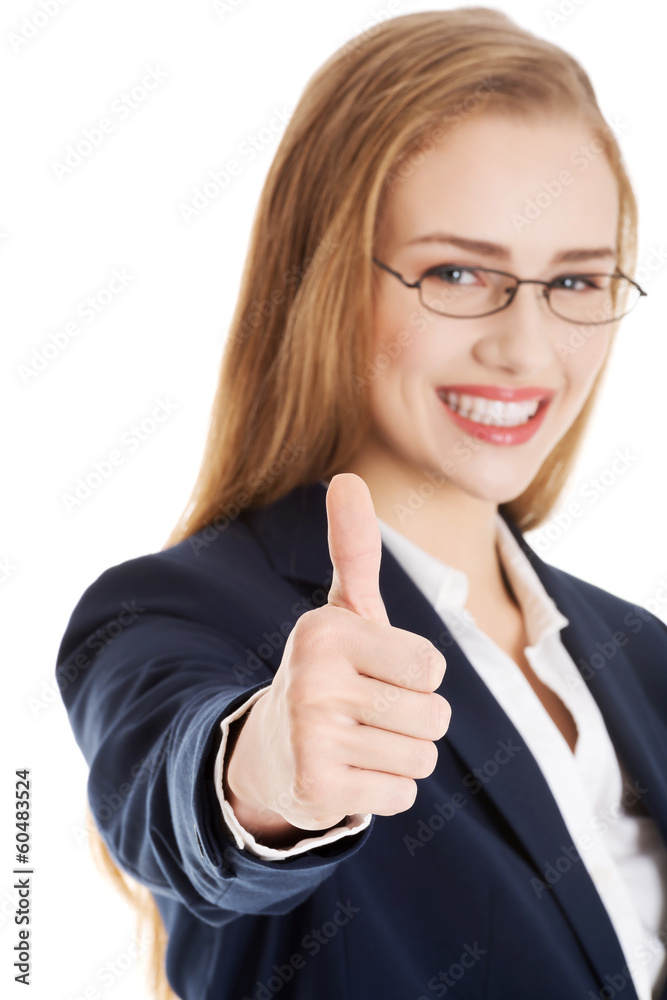 Beautiful business woman with her thumb up, showing oK. Beautiful business woman with her thumb up, showing oK.