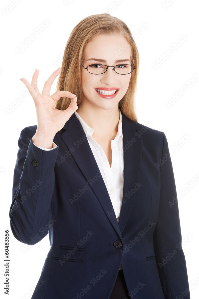 Beautiful business woman showing OK. Beautiful business woman showing OK.