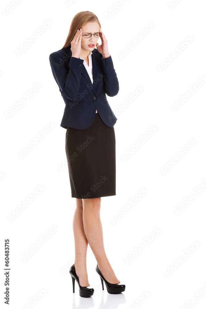Beautiful business woman is having a headache. Beautiful business woman is having a headache.