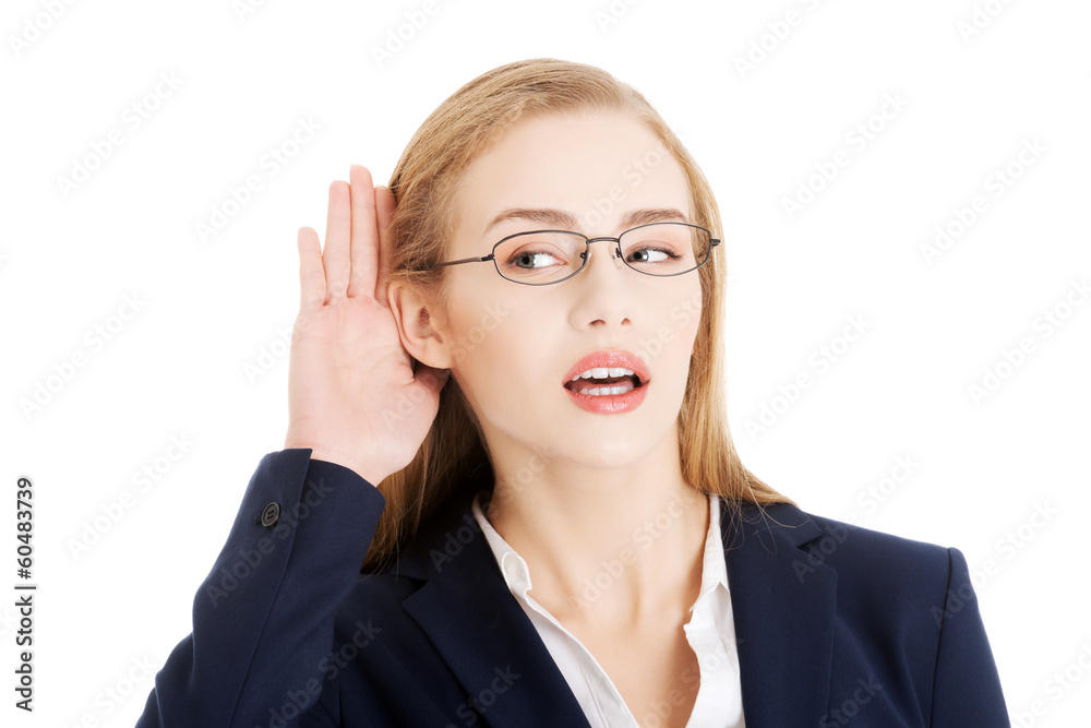 Beautiful business woman is over- hearing, trouching her ear. Beautiful business woman is over- hearing, trouching her ear.