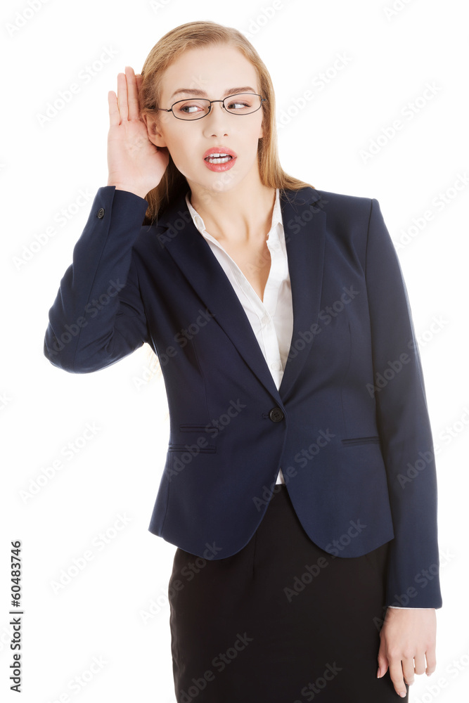 Beautiful business woman is over- hearing, trouching her ear. Beautiful business woman is over- hearing, trouching her ear.