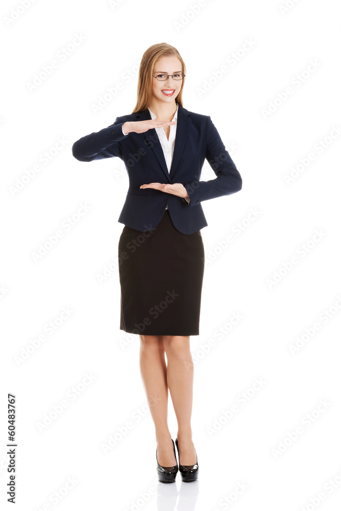 Beautiful business woman holding empty copy space between her ha Beautiful business woman holding empty copy space between her ha