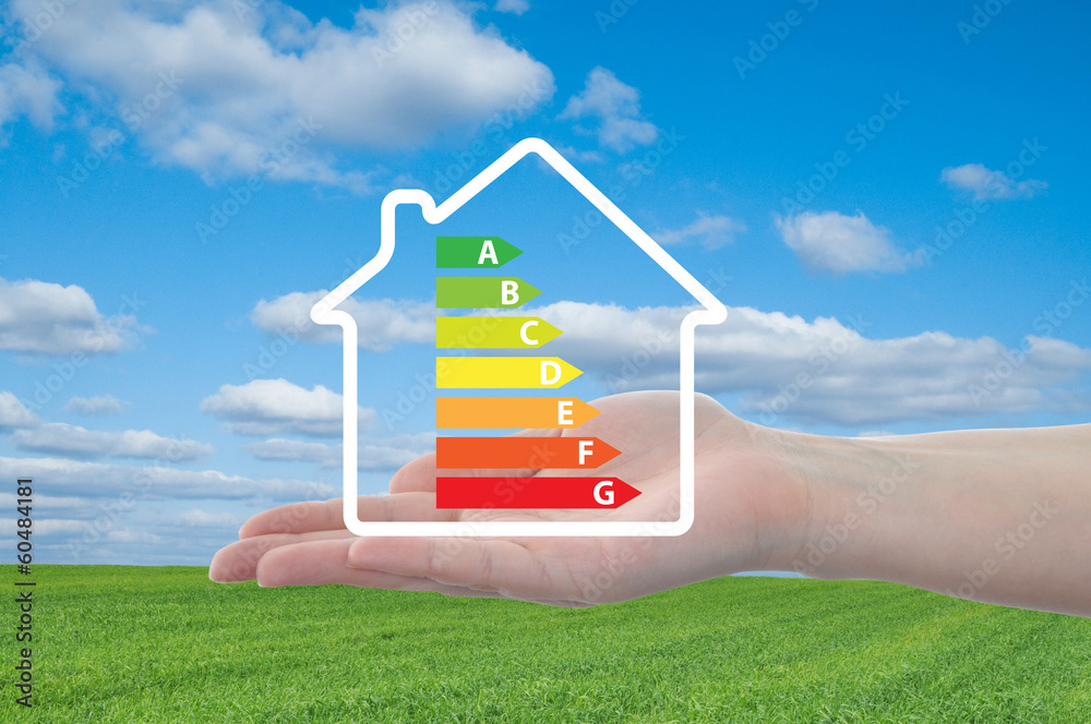 House and energy efficiency graph on hand House and energy efficiency graph on hand