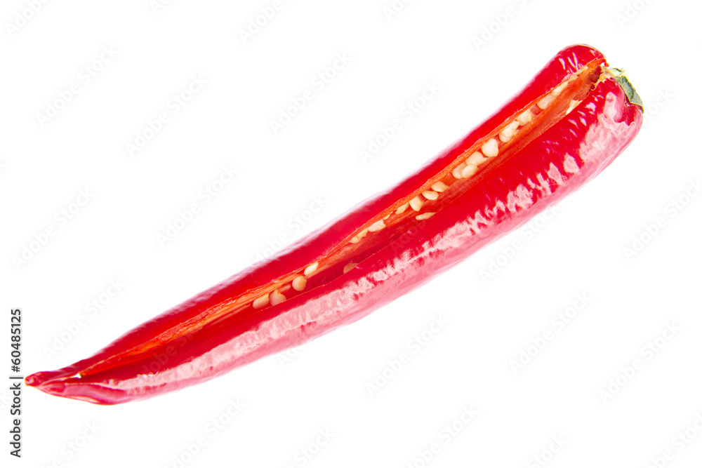 One separated chili pepper cut through lenght. One separated chili pepper cut through lenght.