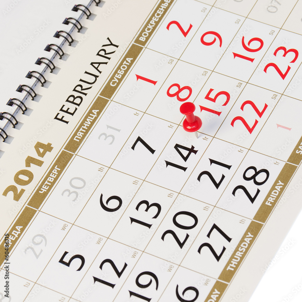 Calendar page with red thumbtack on February 14 2014. Calendar page with red thumbtack on February 14 2014.